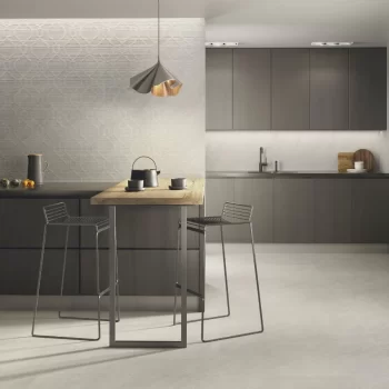 Matte grey porcelain tile resembling limestone, suitable for floors and walls.