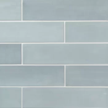 Matte blue ceramic tile in rectangular subway style, ideal for walls.