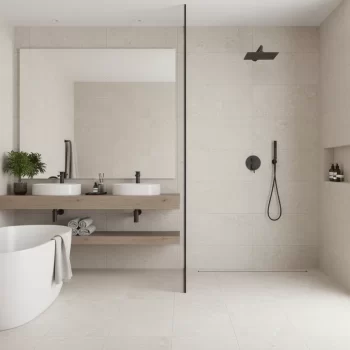 Sand-colored large format porcelain tile with anti-slip finish, resembling limestone.