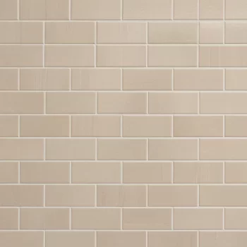 Beige Jolly glossy ceramic subway tile, 1/2x8 inch, ideal for backsplashes and bathrooms.
